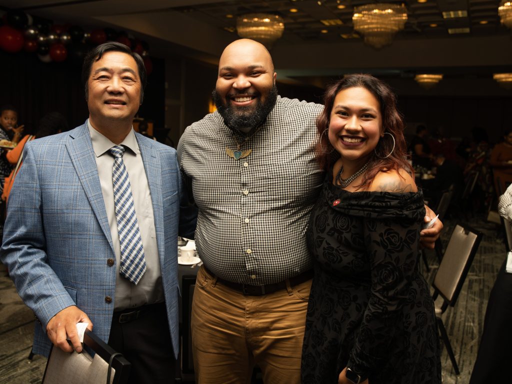 Three attendees at the anniversary event