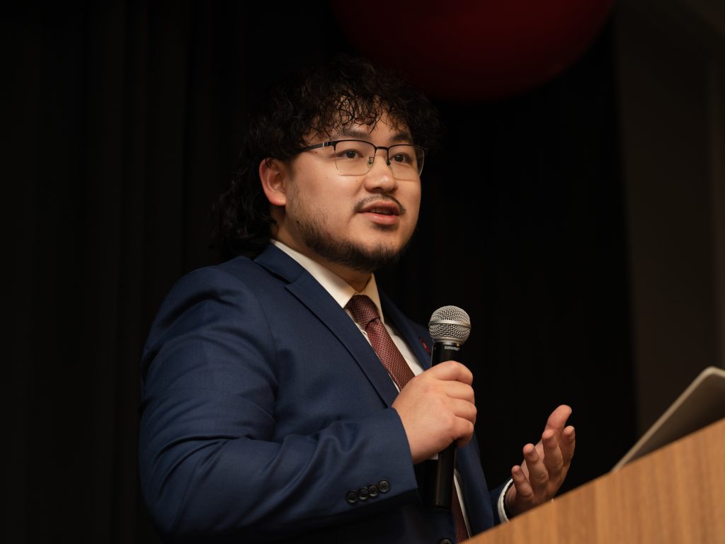 Person speaking at the podium